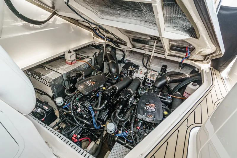 Slide: The Image of Engine compartment of a 2007 Sea Ray 310 Sundancer boat, showcasing mechanical components. - 38