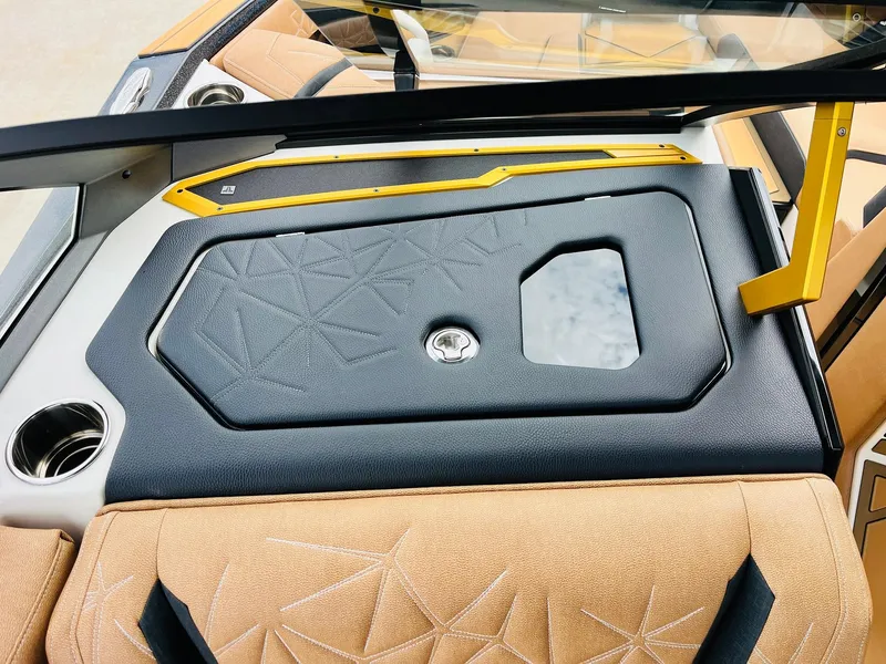 Slide: The Image of 2026 Nautique Super Air Nautique G25 Paragon interior with sleek design and luxurious seating. - 26