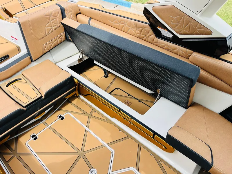 Slide: The Image of 2026 Nautique Super Air Nautique G25 Paragon interior with open storage compartment. - 37