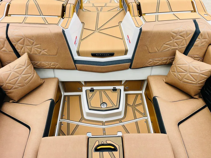 Slide: The Image of Luxurious interior of 2026 Nautique Super Air Nautique G25 Paragon with tan upholstery. - 46