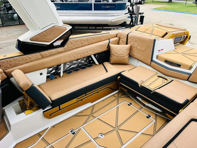 Slide: The Image of 2026 Nautique Super Air Nautique G25 Paragon interior with luxurious tan seating and modern design. - 49