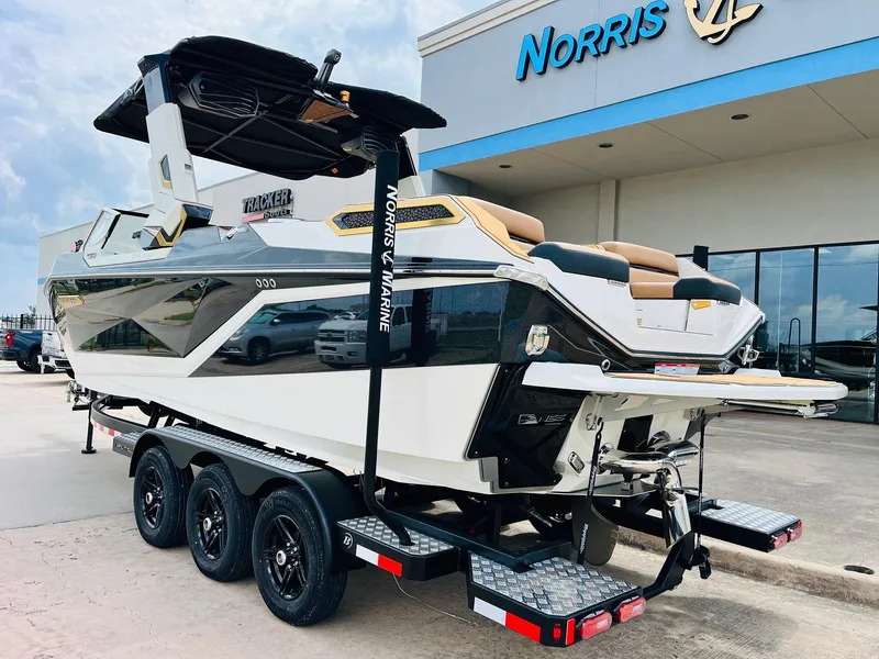 Slide: The Image of 2026 Nautique Super Air Nautique G25 Paragon boat on trailer at dealership. - 5