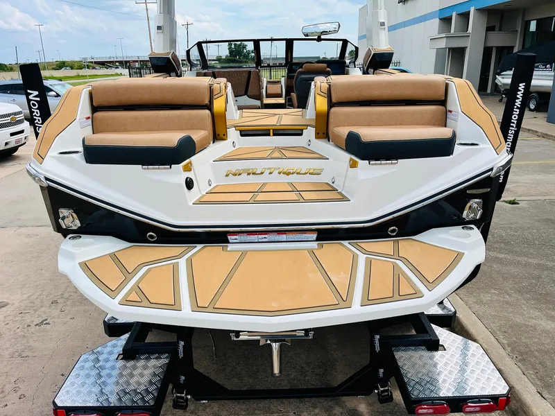 Slide: The Image of 2026 Nautique Super Air Nautique G25 Paragon boat, rear view, on trailer. - 7