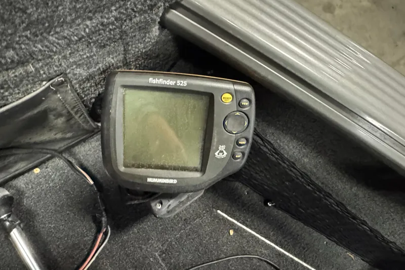 Slide: The Image of Fishfinder 525 device on 2010 Lund 1825 Explorer boat, showing control panel and screen. - 18