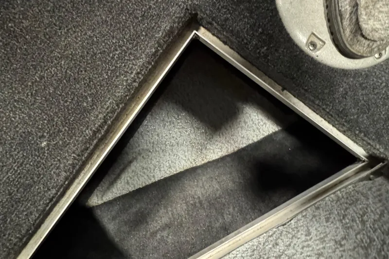 Slide: The Image of Open storage compartment in 2010 Lund 1825 Explorer boat interior. - 20