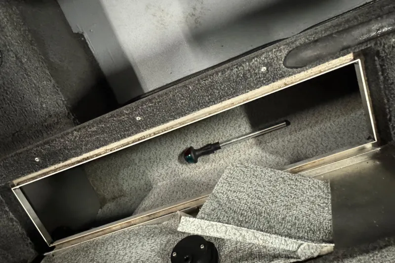 Slide: The Image of Open storage compartment in 2010 Lund 1825 Explorer boat interior. - 22