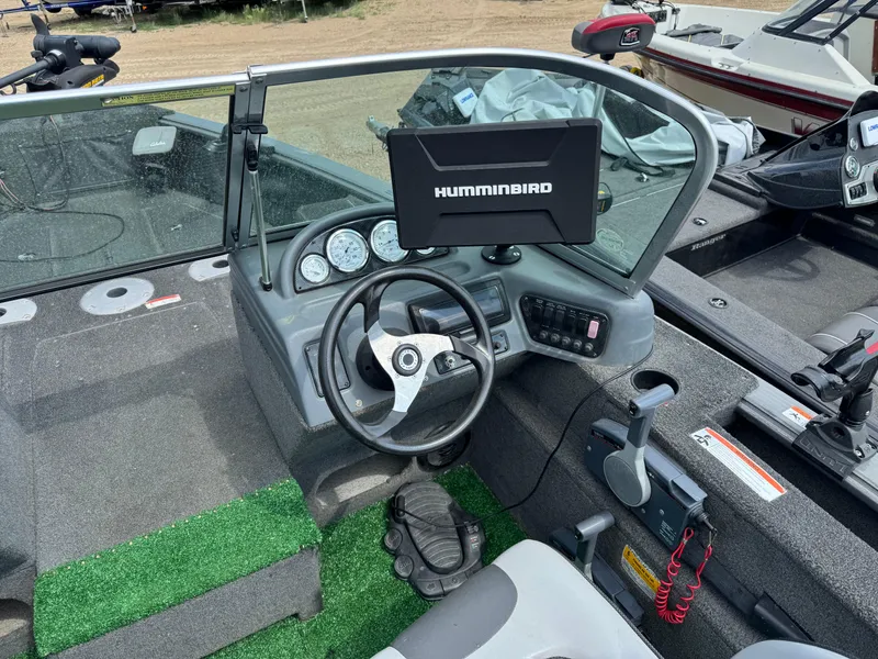 Slide: The Image of 2010 Lund 1825 Explorer boat with visible warning labels and serial number. - 6