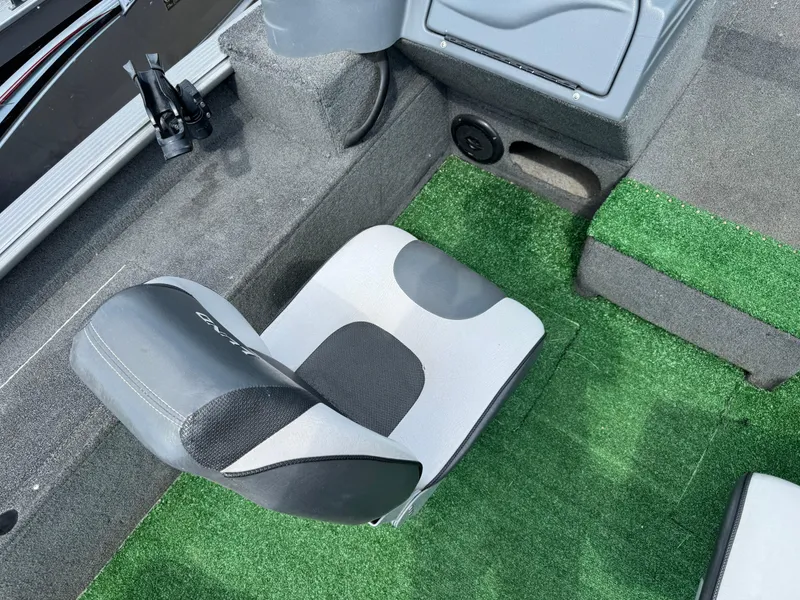 Slide: The Image of Two seats in a 2010 Lund 1825 Explorer boat interior. - 7