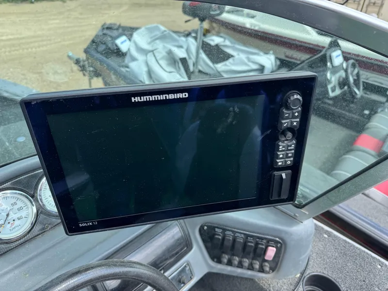 Slide: The Image of 2010 Lund 1825 Explorer boat seat, gray and white upholstery, interior view. - 9