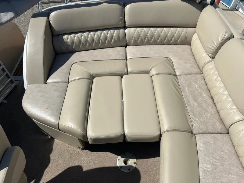 Slide: The Image of Luxurious seating on 2012 Bennington 2250RCL boat with beige upholstery and diamond stitching. - 29