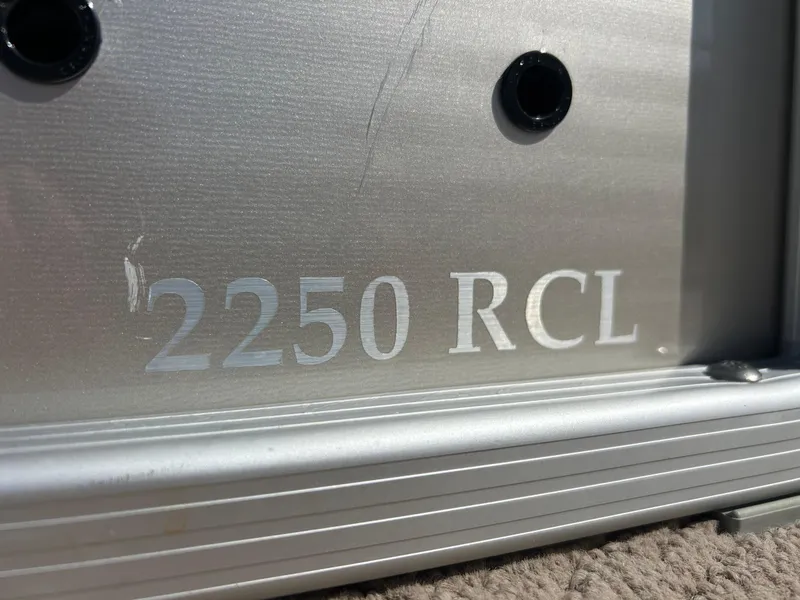 Slide: The Image of 2012 Bennington 2250RCL pontoon boat with beige seating and sleek design. - 42