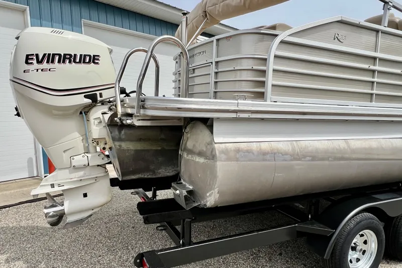 Slide: The Image of 2012 Bennington 2250RCL pontoon boat with Evinrude E-TEC outboard motor. - 49
