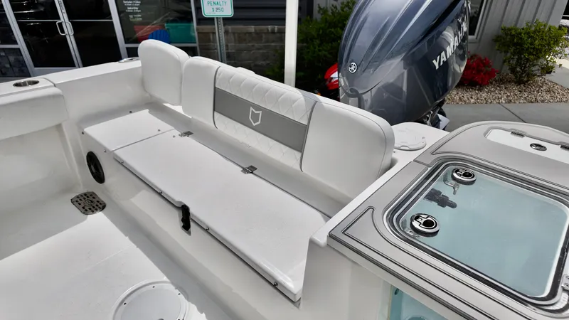 Slide: The Image of 2025 Sea Fox 228 Commander boat interior with seating and Yamaha engine. - 10