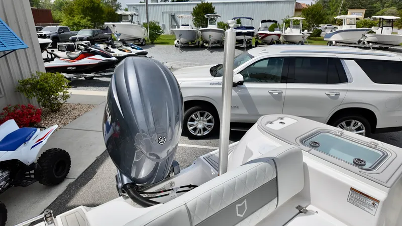 Slide: The Image of 2025 Sea Fox 228 Commander boat with outboard motor in a dealership lot. - 11