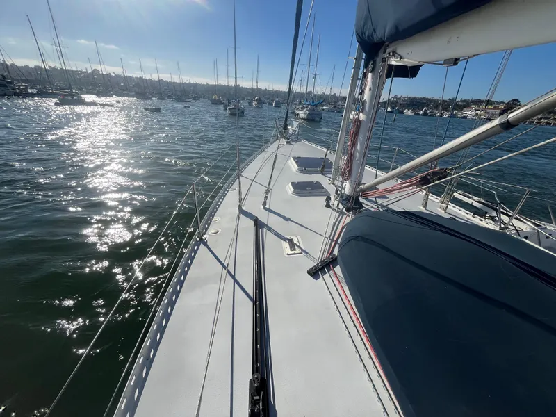 Slide: The Image of Sailboat deck view on water, Frers Custom 1976, sunny day, marina background. - 10