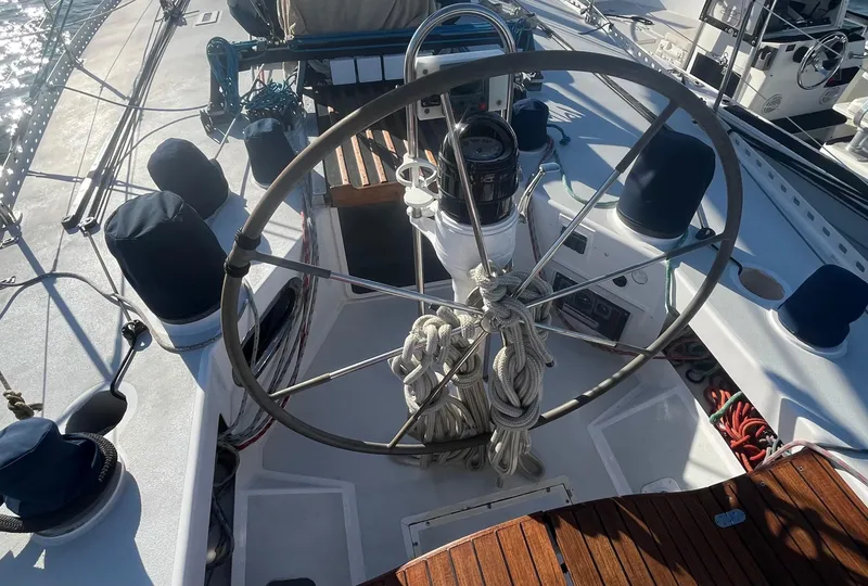 Slide: The Image of 1976 Frers Custom yacht cockpit with large steering wheel and nautical equipment. - 11