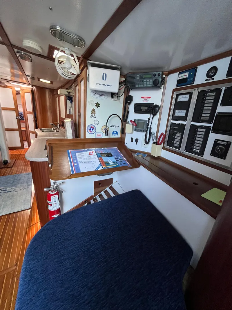 Slide: The Image of Interior of a 1976 Frers Custom yacht with navigation equipment and wooden finishes. - 21