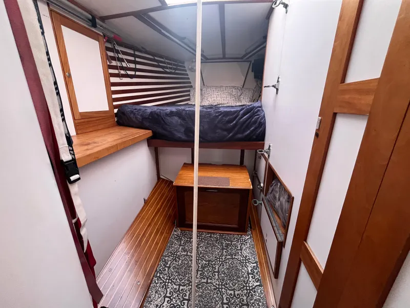 Slide: The Image of 1976 Frers Custom yacht interior with wooden bunk bed and patterned flooring. - 26