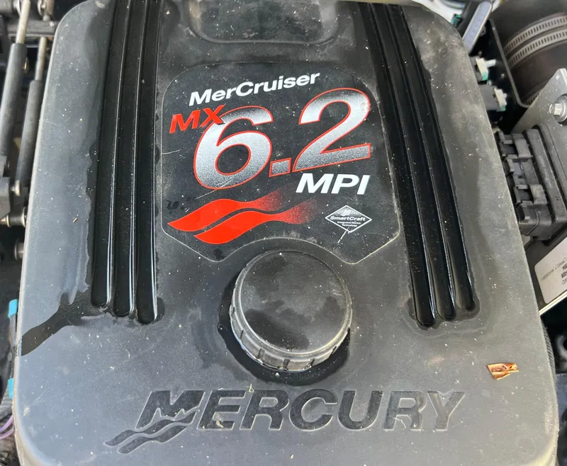Slide: The Image of MerCruiser MX 6.2 MPI engine cover on a 2004 Bennington 2875RLX boat. - 15