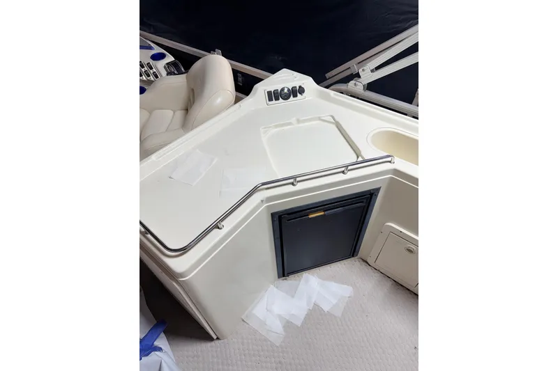 Slide: The Image of 2004 Bennington 2875RLX boat interior with seating and storage compartments. - 21
