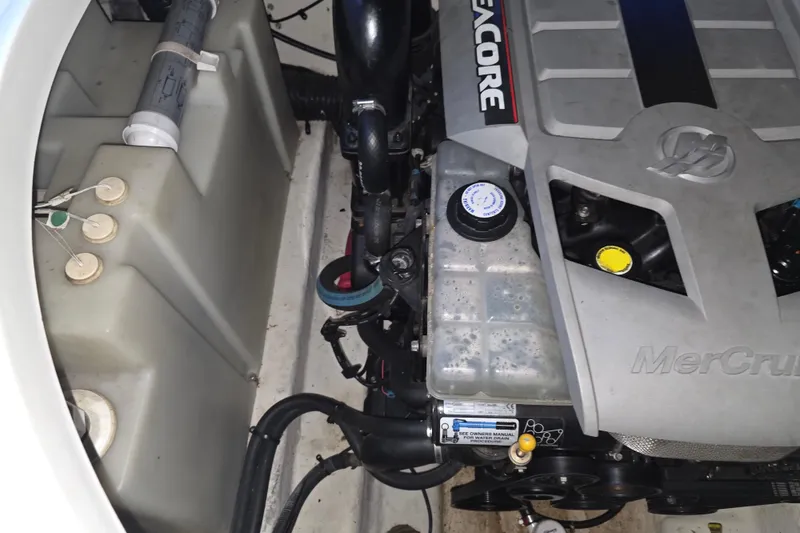 Slide: The Image of Engine compartment of a 2009 Sea Ray 270 Sundancer boat, featuring a MerCruiser engine. - 18