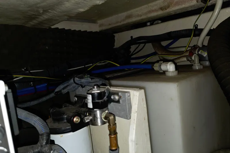 Slide: The Image of Engine compartment of a 2009 Sea Ray 270 Sundancer with visible wiring and components. - 20