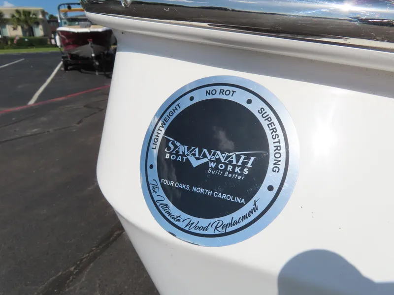 Slide: The Image of Savannah 220 IS boat logo, highlighting lightweight, no rot, superstrong features. - 13