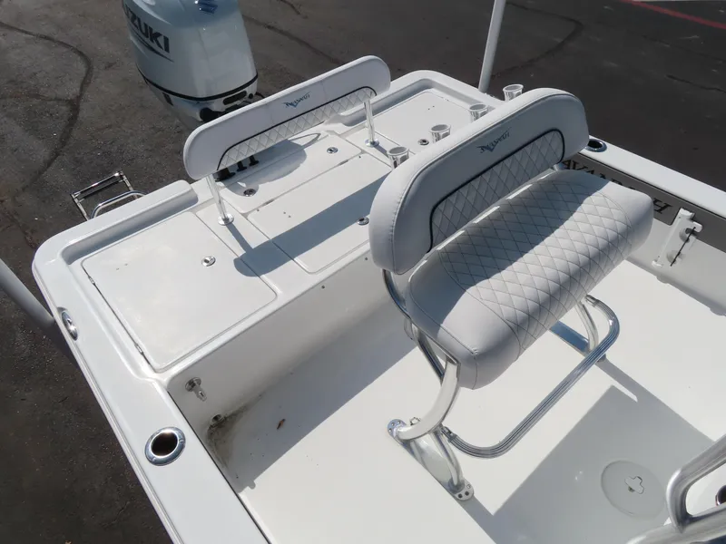 Slide: The Image of 2025 Savannah 220 IS boat interior with cushioned seating and Suzuki engine. - 9