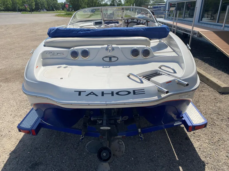 Slide: The Image of 2013 Tahoe Q5i boat on trailer, rear view in outdoor setting. - 10