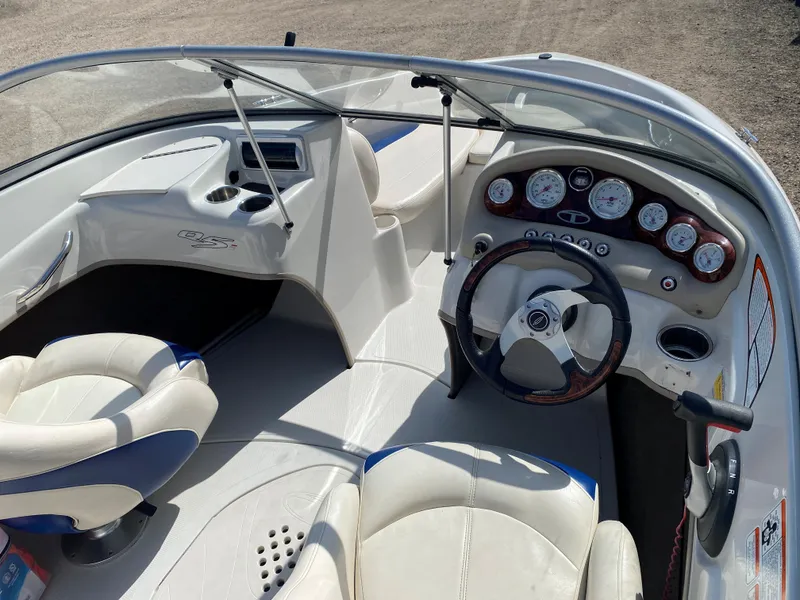 Slide: The Image of 2013 Tahoe Q5i boat interior with steering wheel and dashboard controls. - 6
