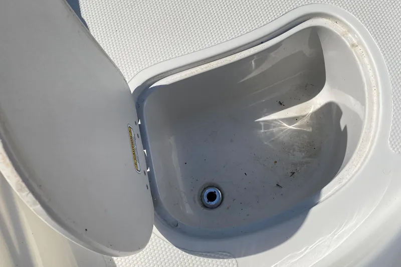 Slide: The Image of Open storage compartment on 2013 Tahoe Q5i boat deck. - 9