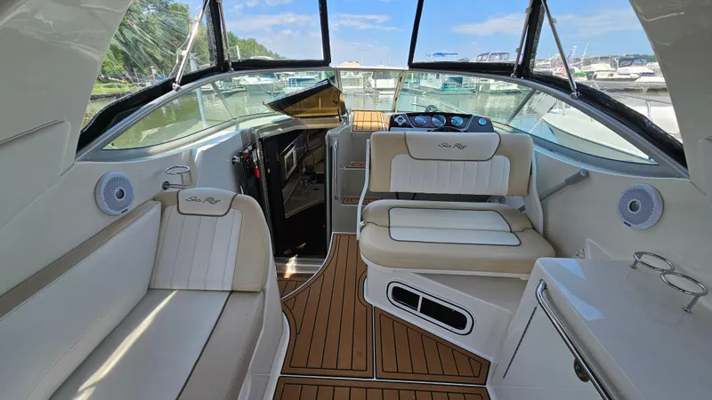 Slide: The Image of Interior of 2013 Sea Ray 280 Sundancer boat with seating and dashboard. - 10