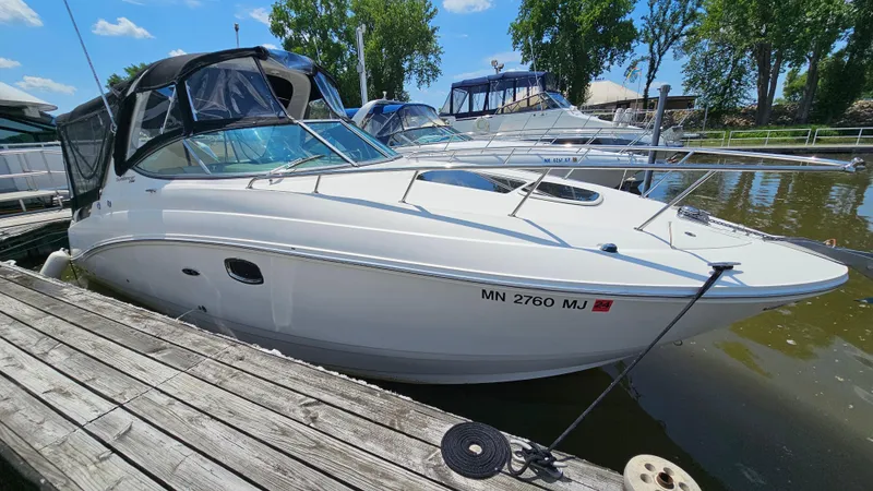 Slide: The Image of 2013 Sea Ray 280 Sundancer docked at marina on a sunny day. - 3