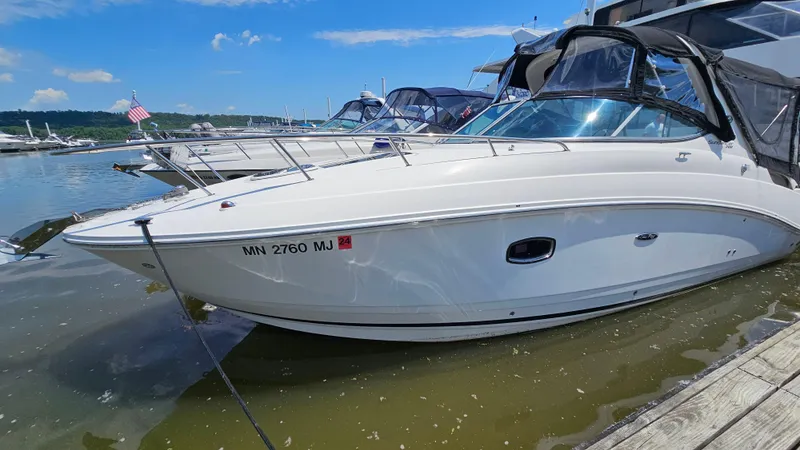 Slide: The Image of 2013 Sea Ray 280 Sundancer docked at a marina on a sunny day. - 4
