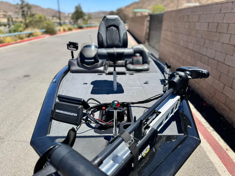 Slide: The Image of 2021 Tracker Pro Team 175 TXW boat with fishing equipment on a sunny day. - 11