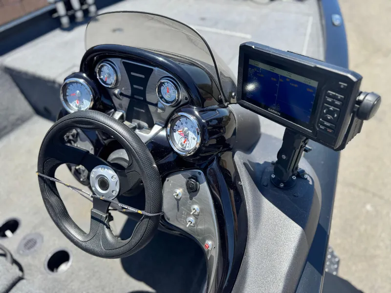 Slide: The Image of 2021 Tracker Pro Team 175 TXW boat dashboard with steering wheel and Garmin fishfinder. - 23