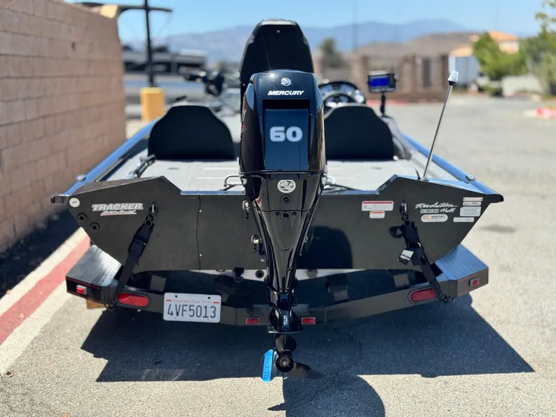 Slide: The Image of 2021 Tracker Pro Team 175 TXW boat with Mercury 60 engine, parked on a trailer. - 8