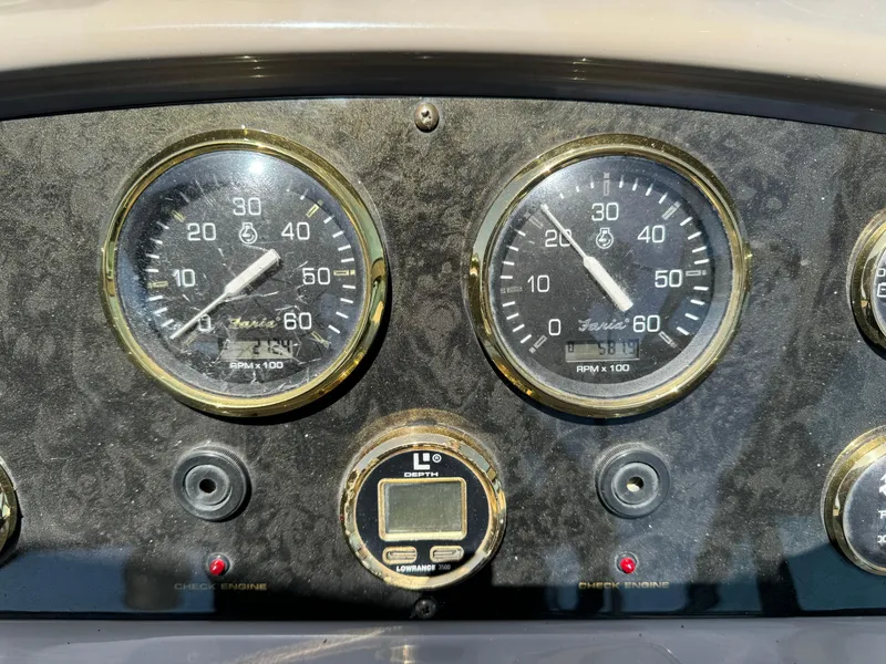 Slide: The Image of Dashboard of 2004 Cruisers Yachts 320 Express with gauges and depth finder. - 18