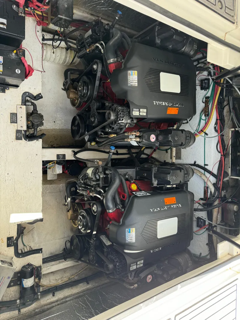 Slide: The Image of Engine compartment of a 2004 Cruisers Yachts 320 Express, featuring dual Volvo Penta engines. - 31