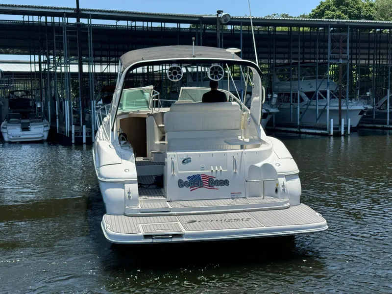 Slide: The Image of 2004 Cruisers Yachts 320 Express docked at marina, rear view. - 5