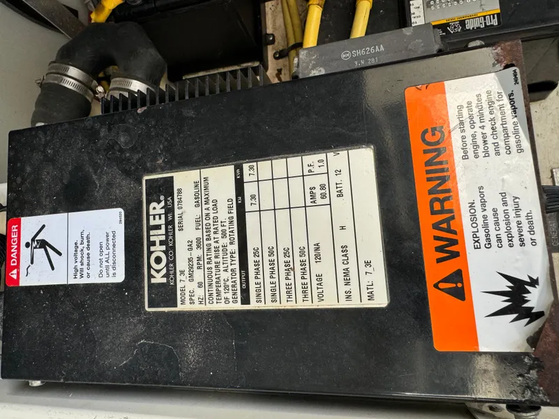 Slide: The Image of Kohler generator warning label on 2004 Cruisers Yachts 320 Express, highlighting safety precautions. - 33