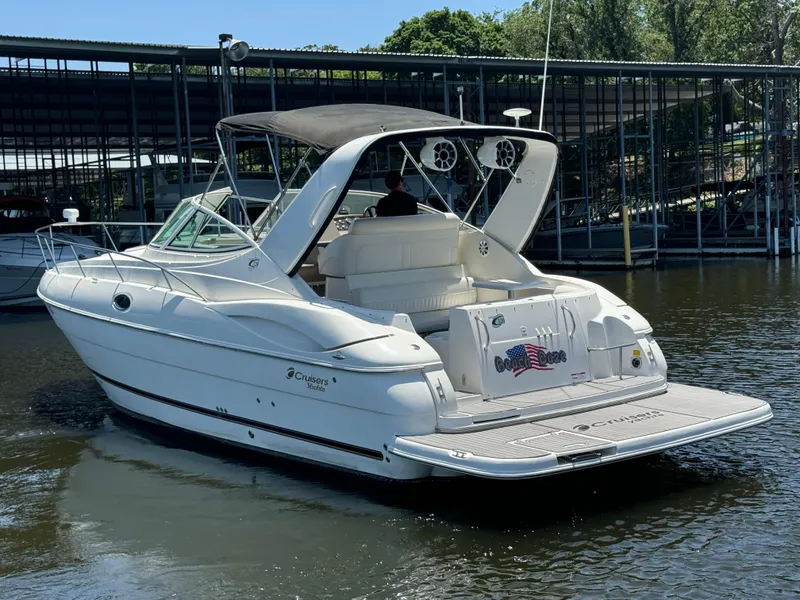 Slide: The Image of 2004 Cruisers Yachts 320 Express docked at marina, rear view. - 6