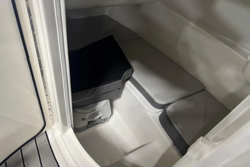 Slide: The Image of Interior cabin of 2026 Sea Ray SDX 230 boat with seating and storage. - 14