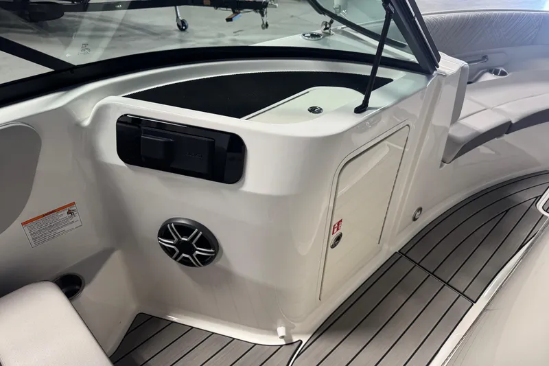 Slide: The Image of 2026 Sea Ray SDX 230 boat interior with sleek seating and modern design features. - 15