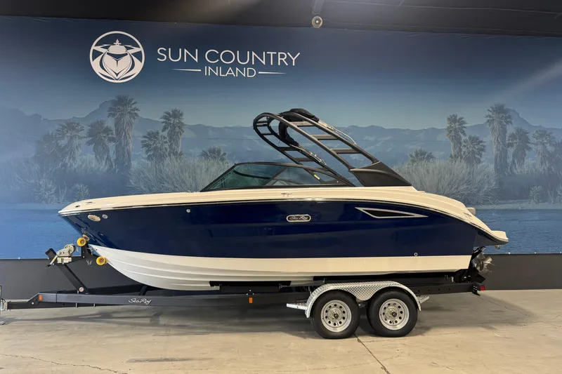 The Image of 2026 Sea Ray SDX 230 boat on trailer at Sun Country Inland showroom. - 2