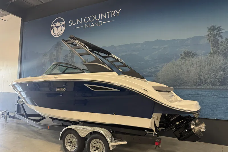 Slide: The Image of 2026 Sea Ray SDX 230 boat on trailer at Sun Country Inland showroom. - 4