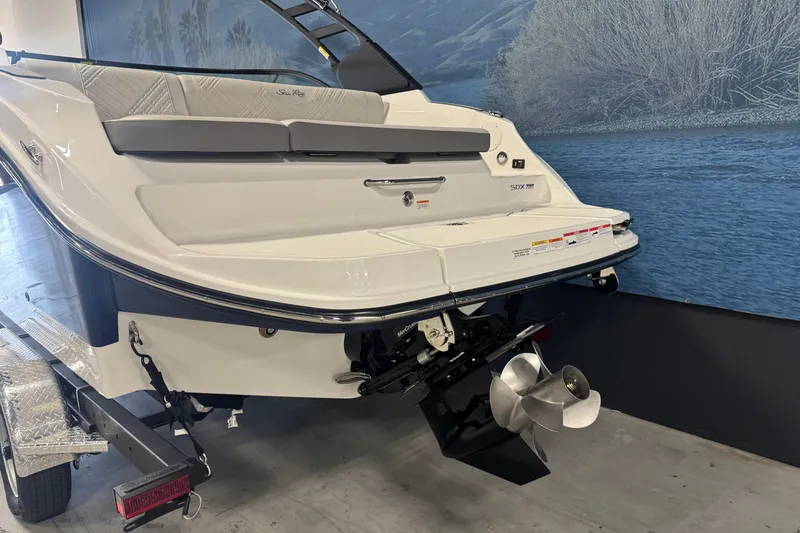 Slide: The Image of 2026 Sea Ray SDX 230 boat rear view with propeller and swim platform. - 5