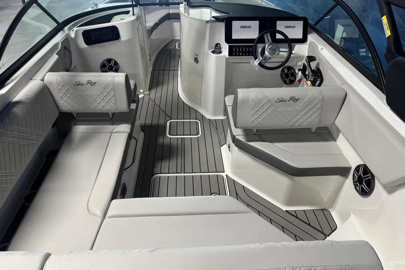 Slide: The Image of Interior of 2026 Sea Ray SDX 230 boat with modern seating and dashboard. - 7