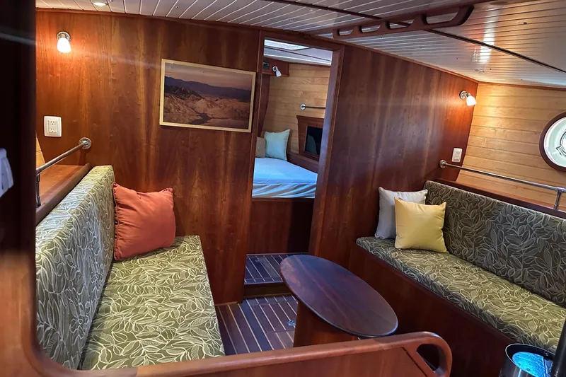 Slide: The Image of Luxurious 2012 Custom Steel Trawler interior with wood paneling and cozy seating. - 35