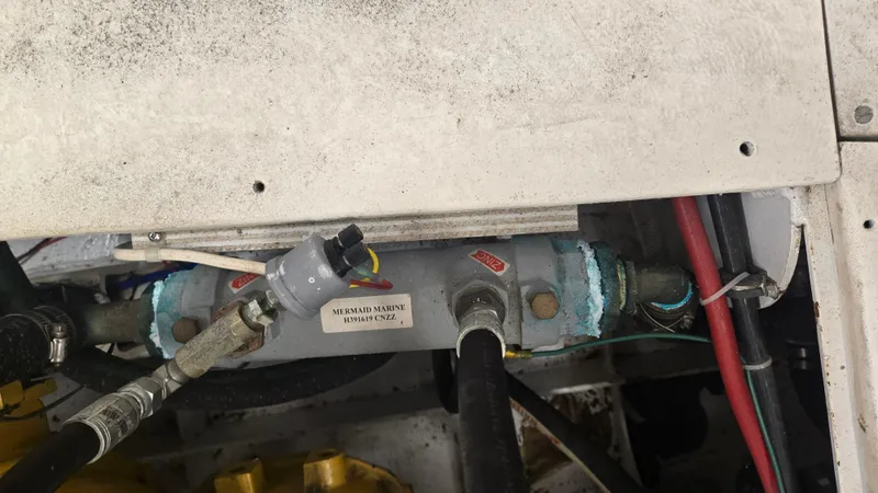 Slide: The Image of Engine compartment of a 2012 Custom Steel Trawler with visible wiring and components. - 60